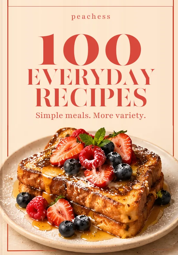 The actual cookbook cover: peachess, 100 Everyday Recipes. Simple meals. More variety. A photo of French toast with berries fills the lower half.